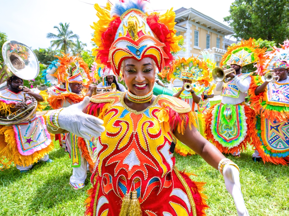 A woman dancing in a traditional Junkanoo costume